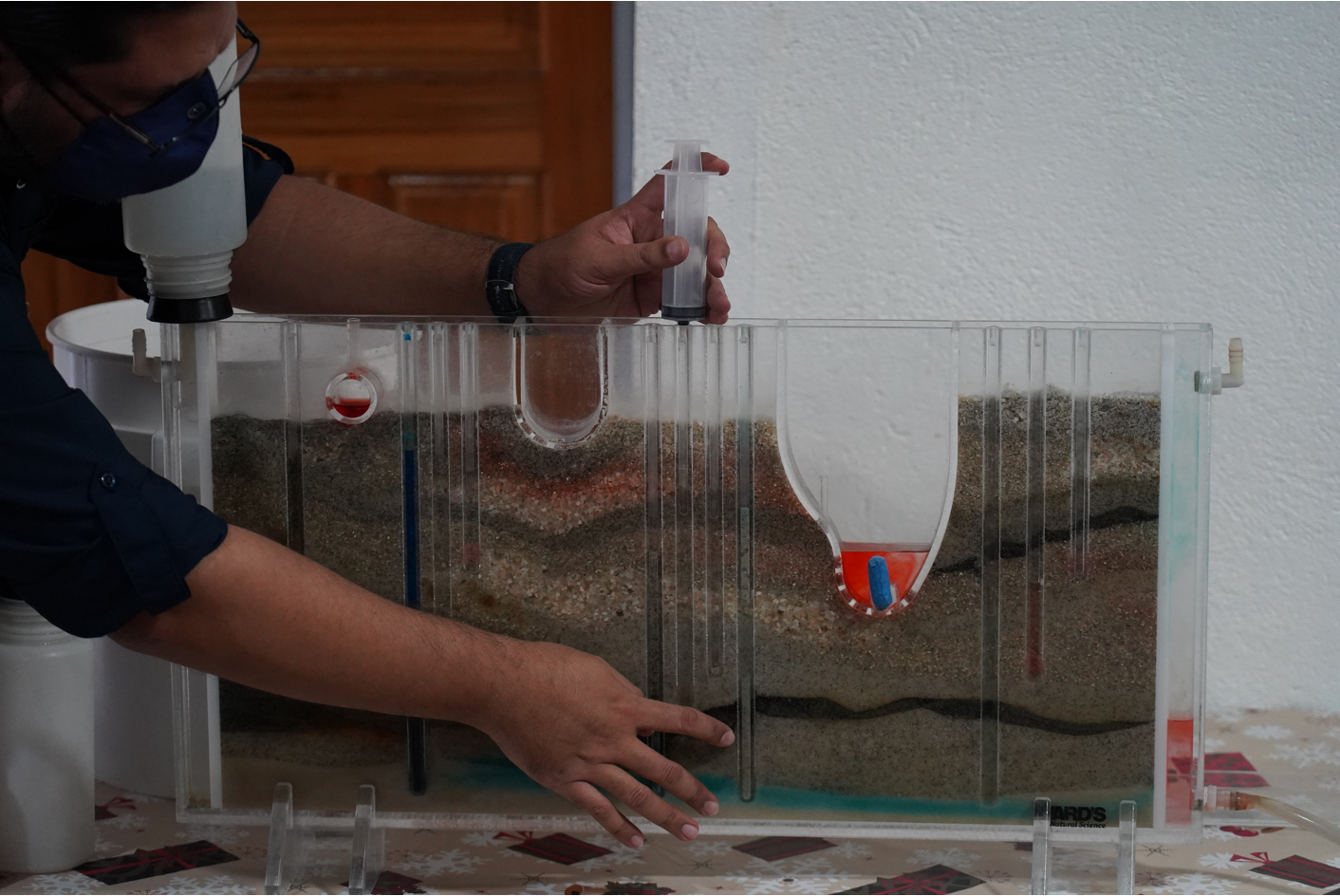 A person working on modeling about aquifers